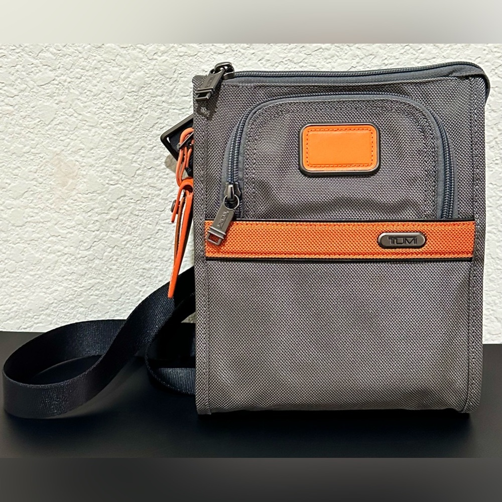 Brand New with Tag Tumi Pocket Bag Small Crossbody in Charcoal Orange